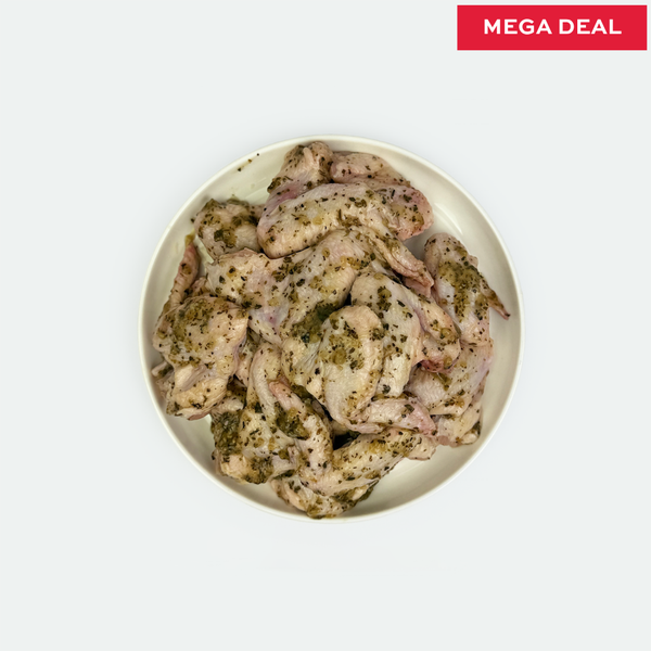 Plated raw chicken wings with marinated lemon, garlic & oregano seasoning on a white background, labeled 'Mega Deal'.