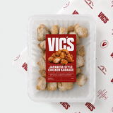 Pack of Vic's Japanese-Style Chicken Karaage in a clear tray with branded red label on Vic's butcher paper.