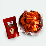 Vics snack chips in a bowl with a red packaging on a white background