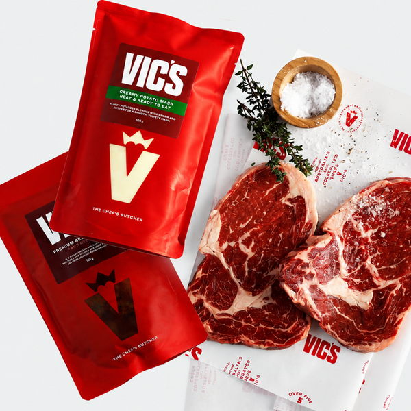 Red Vics packaging with raw steaks on a white background