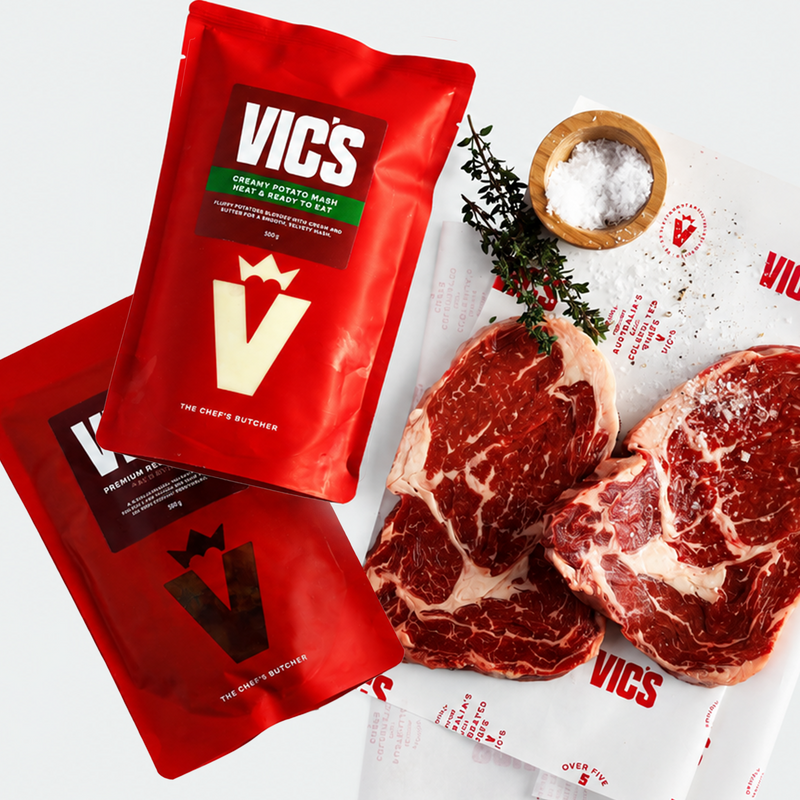 Red Vics packaging with raw steaks on a white background