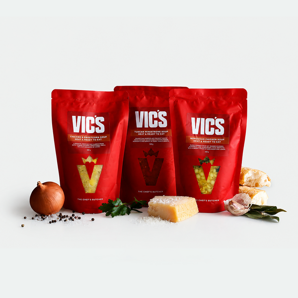 Three red VICS packages on a white background with ingredients around them.