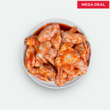 Buffalo marinated chicken wings in a bowl with 'Mega Deal' text on a light gray background
