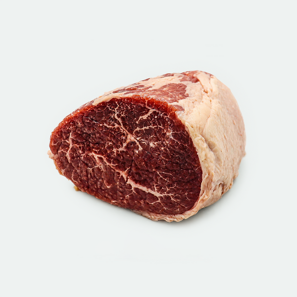 A raw cut of beef steak with visible marbling, photographed on a clean light gray background.