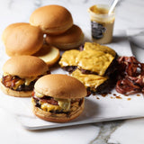 The Burger Kit with Angus beef patties, potato buns, bacon, American cheese and burger sauce
